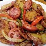 French fries and onions/peppers with smoked sausage
