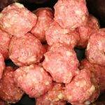 Put meatballs in a slow cooker, but the next 2 ingredients will make it special