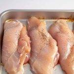 Place raw chicken in baking dish